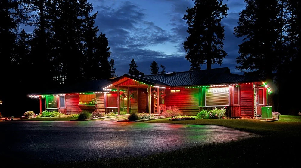 Strathmore home with Christmas red and green permanent lights
